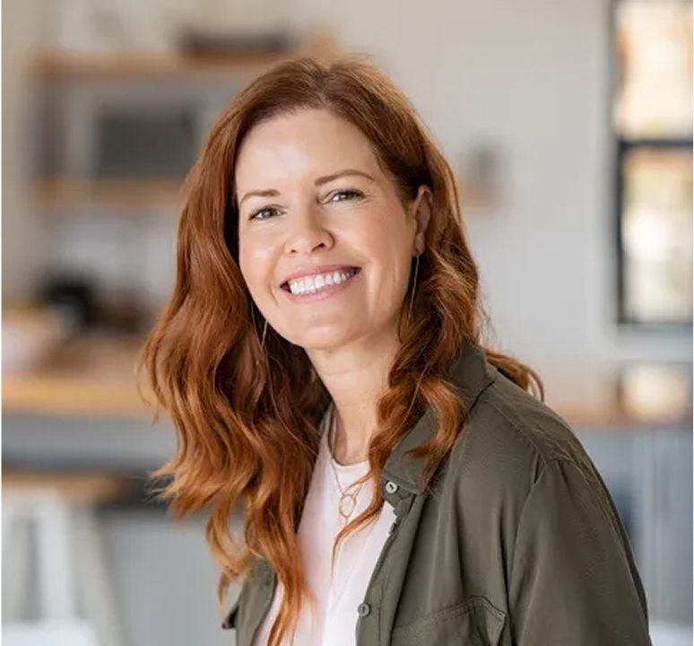 Happy woman with red hair indoors