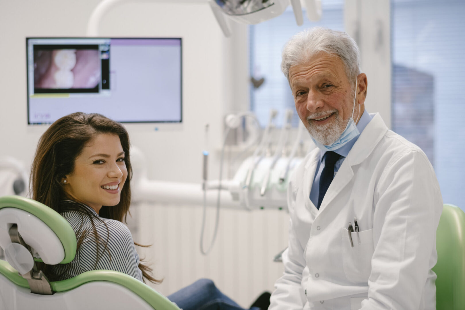 Dental check-up with smiling patient and dentist