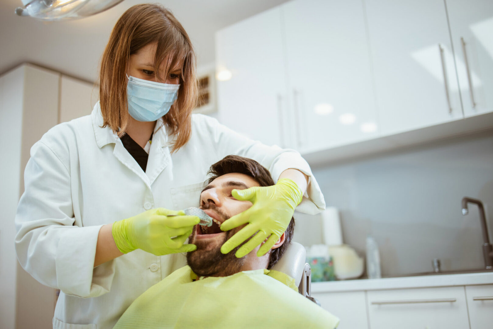 Dentist examining a patient's teeth