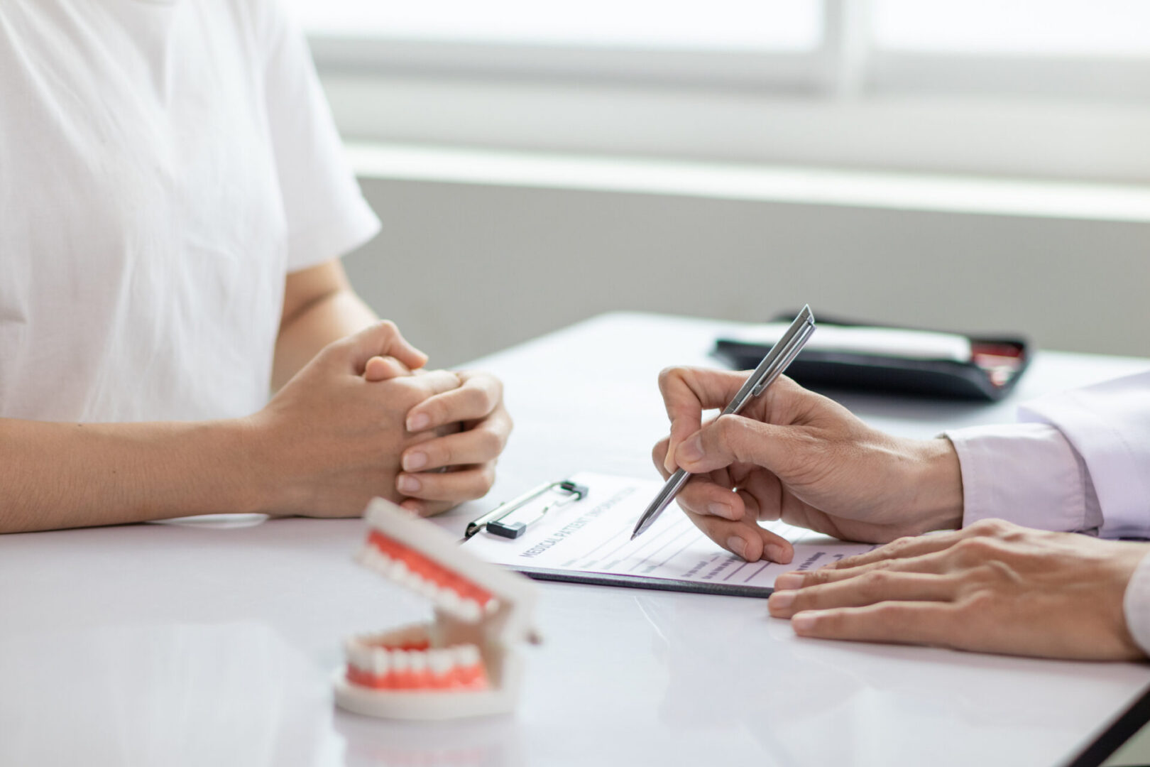 Patient and dentist discussing treatment plan