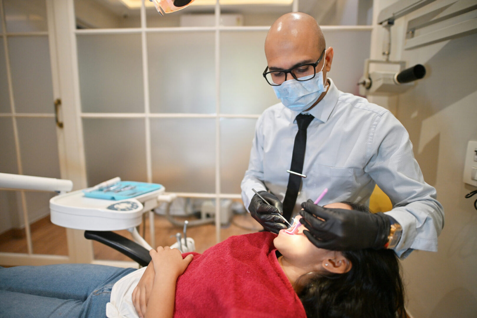 Dentist examining a patient's teeth
