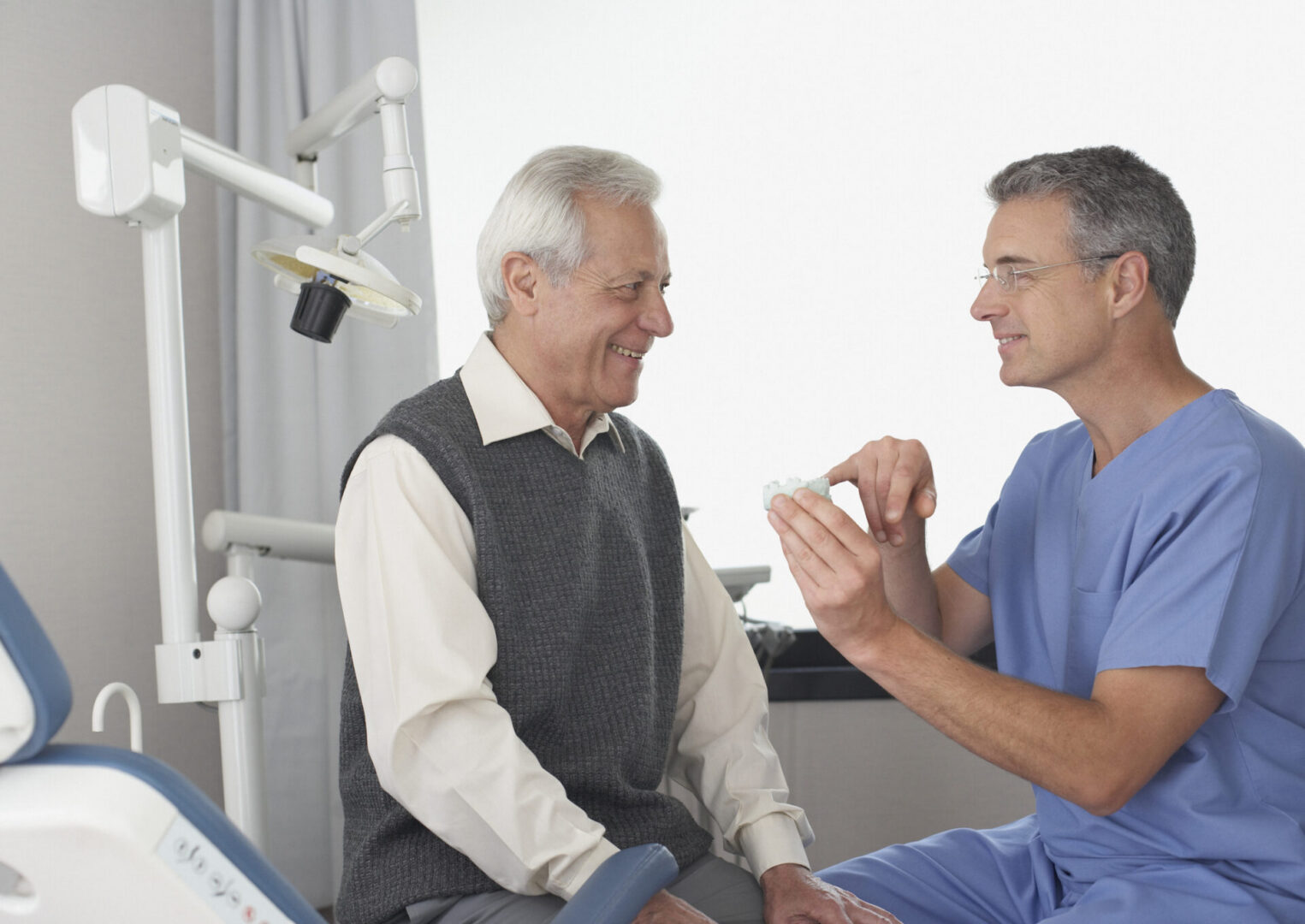 Dentist explaining treatment to patient