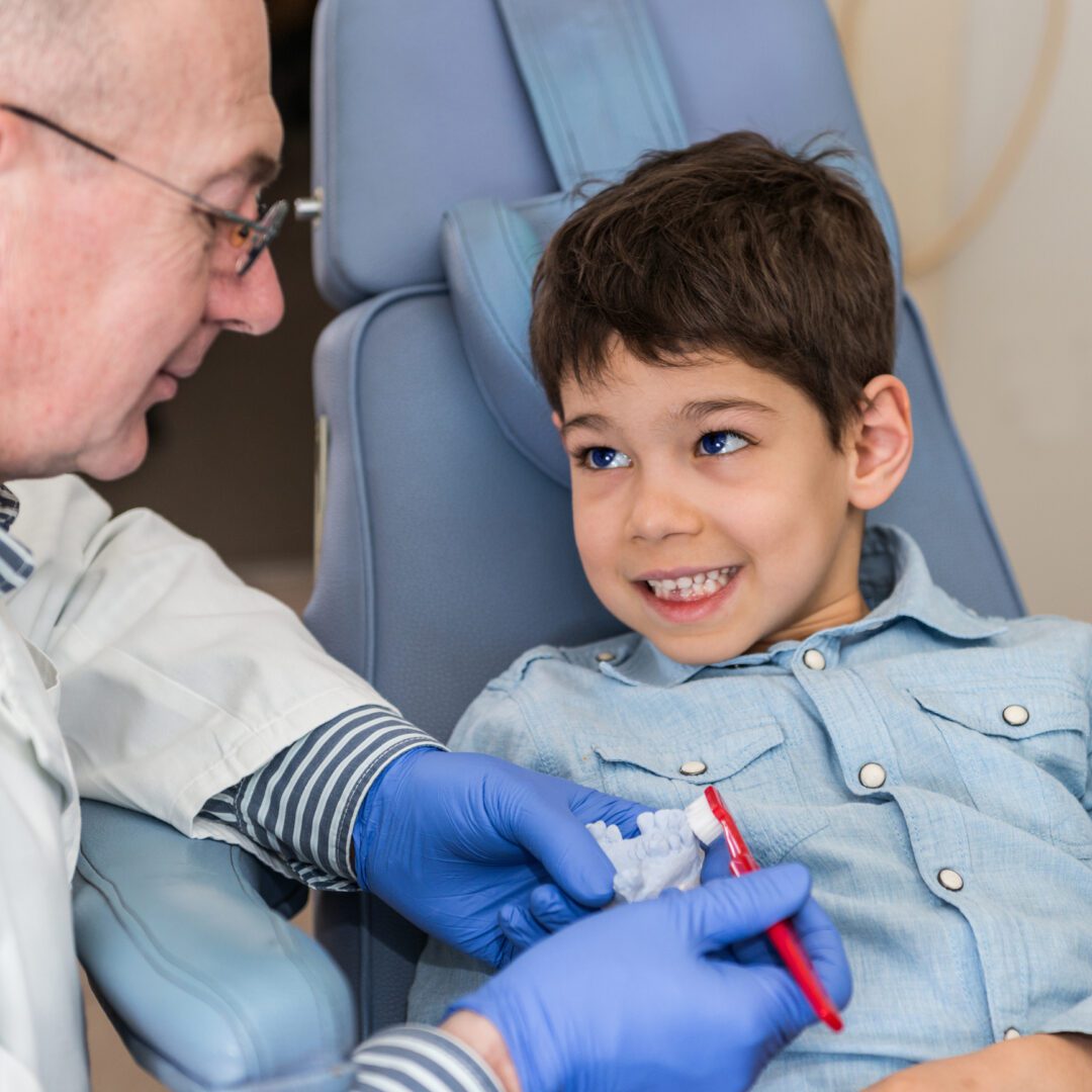 Dentist and child interacting during appointment