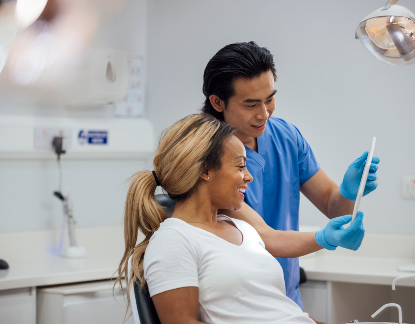 Dentist and patient reviewing dental results