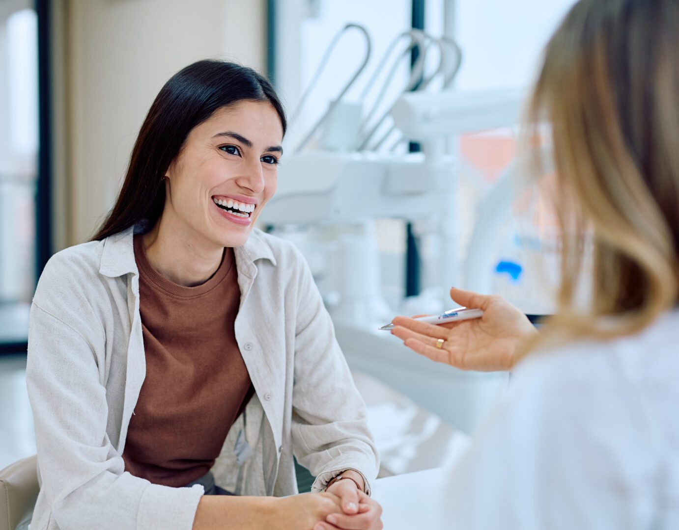 Two people talking in an office setting