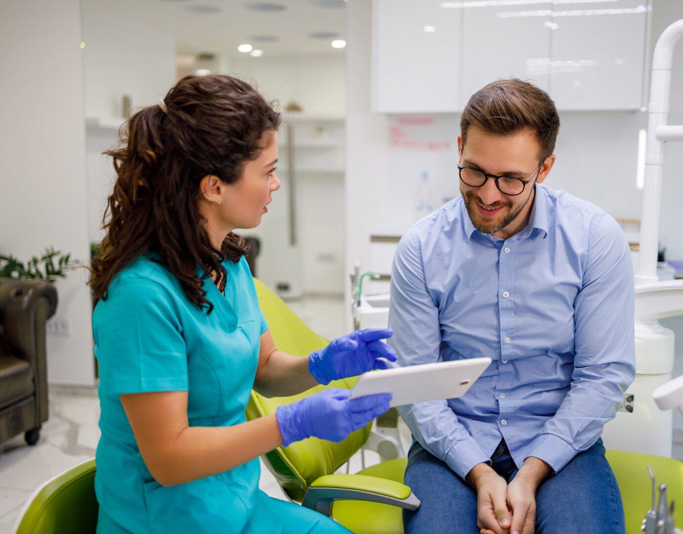 Patient and dentist discussing treatment options