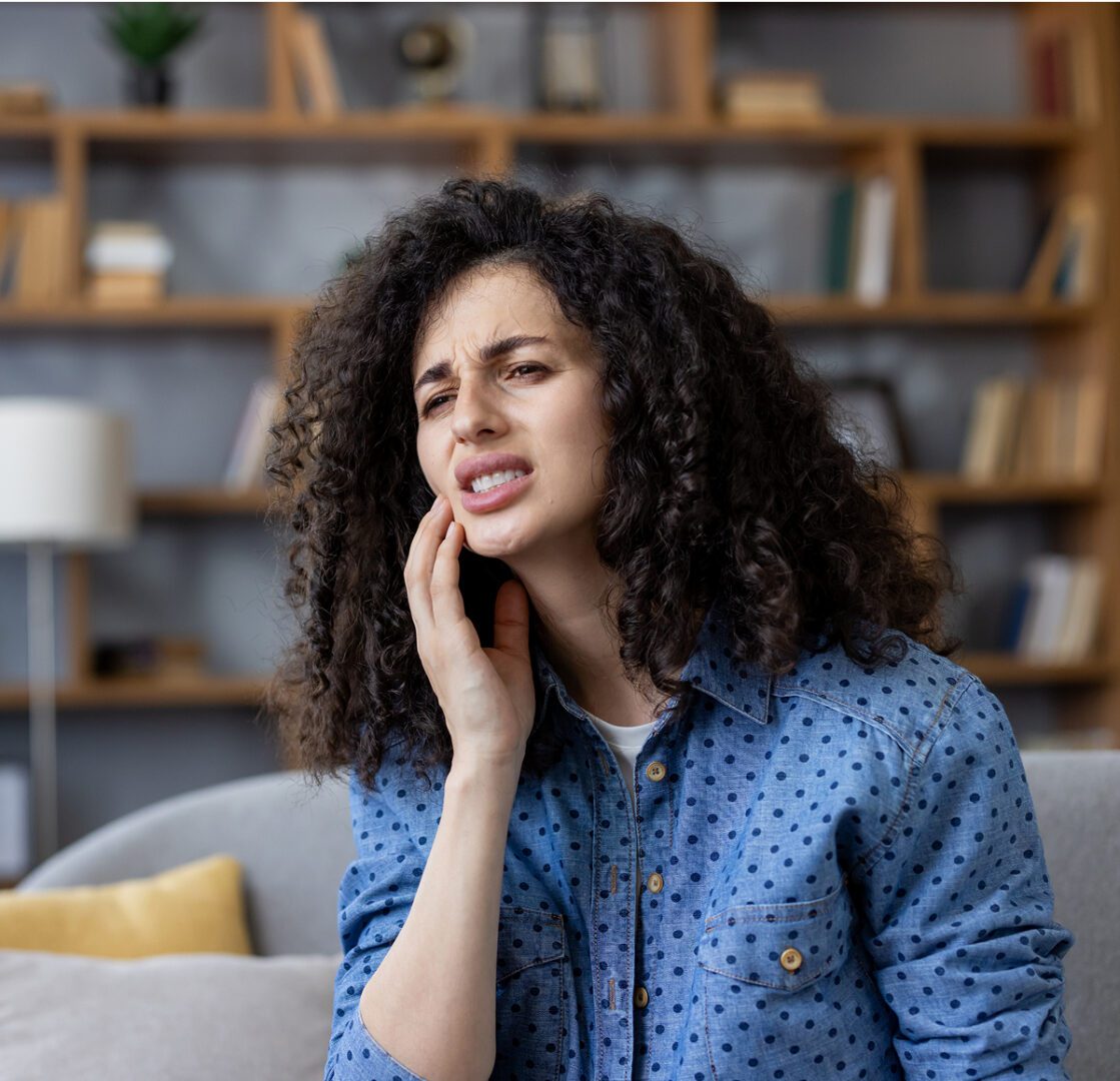 Person with curly hair feeling discomfort