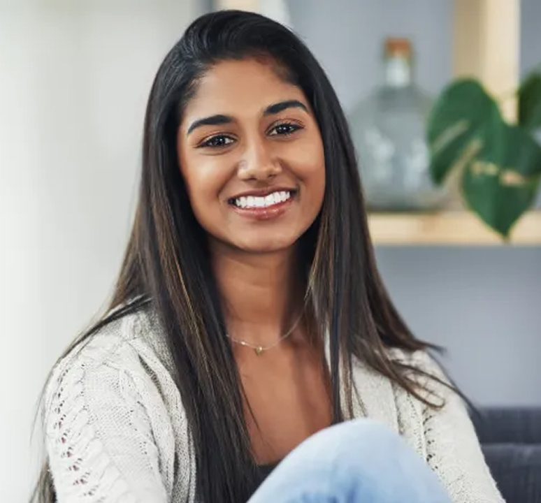 Relaxed woman sitting in a cozy room
