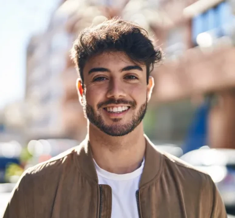 Smiling man outdoors in urban setting
