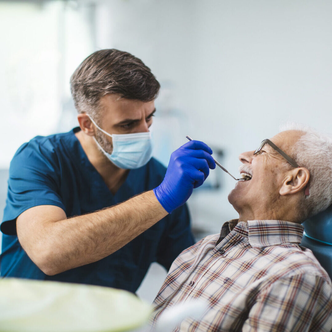 Dentist and patient in clinic chair