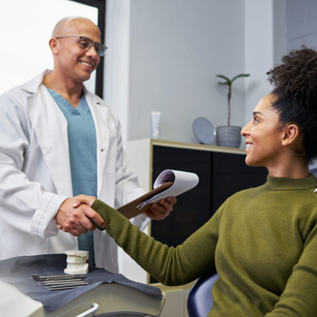 Doctor greeting patient warmly